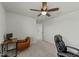 Neutral bedroom featuring a ceiling fan and comfortable seating area at 17 Donatella Way, Angier, NC 27501