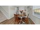Dining room area with wood table and chairs, with decorative pictures on the wall at 17 Donatella Way, Angier, NC 27501