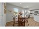 Cozy dining area with a wooden table, chairs, and a window providing natural light at 17 Donatella Way, Angier, NC 27501