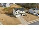 Elevated view of a two-story home with a two-car garage and small front yard at 17 Donatella Way, Angier, NC 27501