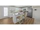 Bright kitchen with stainless steel appliances, granite countertops, and a convenient center island at 17 Donatella Way, Angier, NC 27501