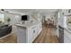 Spacious kitchen island view towards the dining area with seating and a large dining table at 17 Donatella Way, Angier, NC 27501