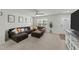 Comfortable living room showcasing ample seating, a large window and entertainment center at 17 Donatella Way, Angier, NC 27501
