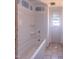 A bathroom with tiled floor and a window that provides natural light at 1905 Old Bramble Ln # 4, Fuquay Varina, NC 27526