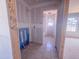 In-progress bathroom with tub, large window, and tiled floor at 1905 Old Bramble Ln # 4, Fuquay Varina, NC 27526