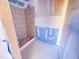 Unfinished bathroom featuring a tiled shower with new shower floor and tiled surround, awaiting final touches at 1905 Old Bramble Ln # 4, Fuquay Varina, NC 27526