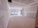 Bedroom featuring large windows offering natural light, and drywall ready for finishes in an unfinished new home at 1905 Old Bramble Ln # 4, Fuquay Varina, NC 27526
