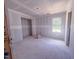 A bright bedroom with large windows, in the process of being completed at 1905 Old Bramble Ln # 4, Fuquay Varina, NC 27526
