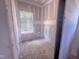 Unfinished bedroom showcasing natural light from a window, ready for personalized finishing touches at 1905 Old Bramble Ln # 4, Fuquay Varina, NC 27526