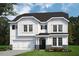 Charming two-story home featuring white siding, black shutters, and a well-manicured front lawn at 1905 Old Bramble Ln # 4, Fuquay Varina, NC 27526