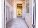 View of the foyer featuring hexagon tile flooring and a glimpse into the home's interior, showcasing natural light at 1905 Old Bramble Ln # 4, Fuquay Varina, NC 27526