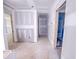 Hallway view showing drywall, open doorways, and natural light illuminating the unfinished construction of a new home at 1905 Old Bramble Ln # 4, Fuquay Varina, NC 27526