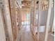 Hallway under construction showing framing and plumbing ready for walls and floors at 1905 Old Bramble Ln # 4, Fuquay Varina, NC 27526