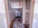 Narrow, unfinished hallway with visible wall framing at 1905 Old Bramble Ln # 4, Fuquay Varina, NC 27526