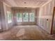 Bright unfinished living room filled with natural light from multiple windows, awaiting personalized finishing touches at 1905 Old Bramble Ln # 4, Fuquay Varina, NC 27526
