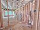 A wide-open living room layout during the framing stage and insulation installation at 1905 Old Bramble Ln # 4, Fuquay Varina, NC 27526