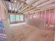 Spacious living room is under construction with large windows and wood framework at 1905 Old Bramble Ln # 4, Fuquay Varina, NC 27526