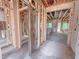 Spacious unfinished living room framed with wood studs and awaiting your design at 1905 Old Bramble Ln # 4, Fuquay Varina, NC 27526