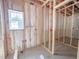 Insulated room with plumbing, framing, and a window at 1905 Old Bramble Ln # 4, Fuquay Varina, NC 27526