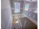 View of a staircase with drywall, windows, and natural light illuminating the unfinished construction of a new home at 1905 Old Bramble Ln # 4, Fuquay Varina, NC 27526