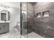 Modern bathroom featuring a glass enclosed shower, gray tile, and built-in shower niches at 200 Single Tree Cir, Haw River, NC 27258