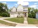 Charming two-story home with attached two-car garage and lush green lawn at 200 Single Tree Cir, Haw River, NC 27258