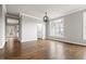 Bright living room with hardwood floors, crown molding, and large windows at 200 Single Tree Cir, Haw River, NC 27258