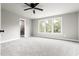 Spacious main bedroom with a ceiling fan, plush carpeting, and large windows for plenty of light at 200 Single Tree Cir, Haw River, NC 27258