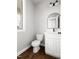 Modern powder room featuring sleek vanity and dark hardware at 200 Single Tree Cir, Haw River, NC 27258