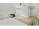 Bright bedroom with light gray walls, built-in desk, ceiling fan, and double door closet at 212 Lynch Ave, Lillington, NC 27546