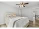 A bedroom featuring hardwood floors, a ceiling fan, and a queen bed at 212 Lynch Ave, Lillington, NC 27546
