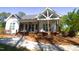 Charming home featuring a cozy front porch, craftsman columns and beautiful landscaping at 212 Lynch Ave, Lillington, NC 27546