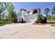 Two-story home with white siding, a side-entry garage and a sprawling lawn at 212 Lynch Ave, Lillington, NC 27546