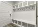 Mudroom with built-in bench, storage cubbies, and hooks for organization near the entrance at 212 Lynch Ave, Lillington, NC 27546