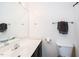 Bathroom featuring a white sink and toilet, a mirror, and a towel rack and shower with curtain at 2203 Eider Ct # A, Graham, NC 27253