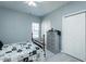 Bedroom featuring a ceiling fan, light-toned walls, light gray laminate wood flooring and two closets at 2203 Eider Ct # A, Graham, NC 27253