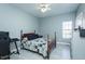 This spacious bedroom features a ceiling fan, light-toned walls, and light gray laminate wood flooring at 2203 Eider Ct # A, Graham, NC 27253