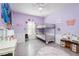 bedroom features playful decor, a bunk bed, and light gray laminate wood flooring at 2203 Eider Ct # A, Graham, NC 27253
