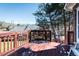 View of the wood deck overlooking the backyard and trees at 2203 Eider Ct # A, Graham, NC 27253