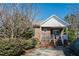 Inviting brick home featuring a quaint front porch and manicured shrubs at 2203 Eider Ct # A, Graham, NC 27253