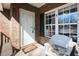 Close-up of the porch with a welcome mat and chair at 2203 Eider Ct # A, Graham, NC 27253