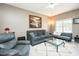Inviting living room showcasing comfortable seating, a ceiling fan, and bright windows at 2203 Eider Ct # A, Graham, NC 27253