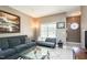 Bright living room showcasing a plush sofa and open access to another room at 2203 Eider Ct # A, Graham, NC 27253