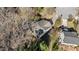 Overhead view of a house with a shingled roof, surrounded by a tree lined yard near a quiet neighborhood at 224 Hartshorn Ct, Holly Springs, NC 27540