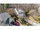 Aerial view of the house with mature trees and two-car garage at 224 Hartshorn Ct, Holly Springs, NC 27540