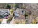 Aerial view of the house with mature trees and two-car garage at 224 Hartshorn Ct, Holly Springs, NC 27540
