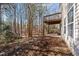 Backyard showing the deck and wooded area at 224 Hartshorn Ct, Holly Springs, NC 27540