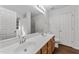 Bathroom with double sink vanity, large mirror, and plenty of counter space at 224 Hartshorn Ct, Holly Springs, NC 27540
