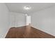 Bright bedroom with wood-look floors and two closets at 224 Hartshorn Ct, Holly Springs, NC 27540
