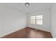 A bright bedroom showcasing attractive flooring and a window that provides natural light at 224 Hartshorn Ct, Holly Springs, NC 27540